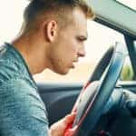 Person in car listening for noises