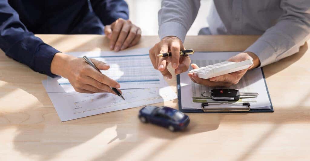 Car-Insurance-document-or-lease-concept-the-car-broker-assisting-his-customer