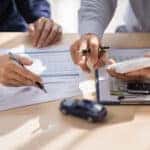 Car-Insurance-document-or-lease-concept-the-car-broker-assisting-his-customer
