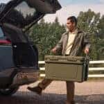 Toyota-RAV4--man-loading-box-into-trunk