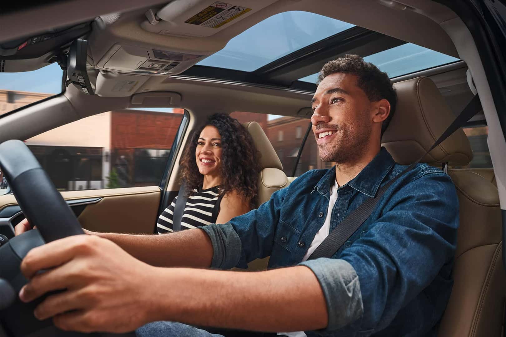 two people in vehicle driving
