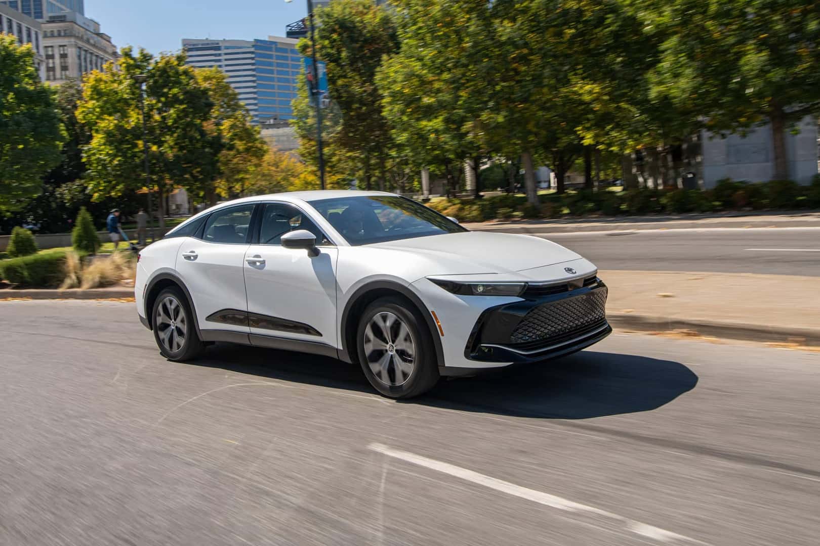 white 2026 toyota crown driving on street