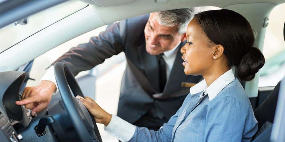 Woman Test Driving A Car
