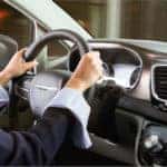 Woman driving while using Apple CarPlay