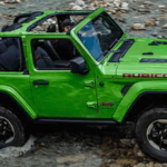 Bright green Wrangler parked on a rocky surface