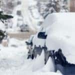 Cars and roads covered with snow
